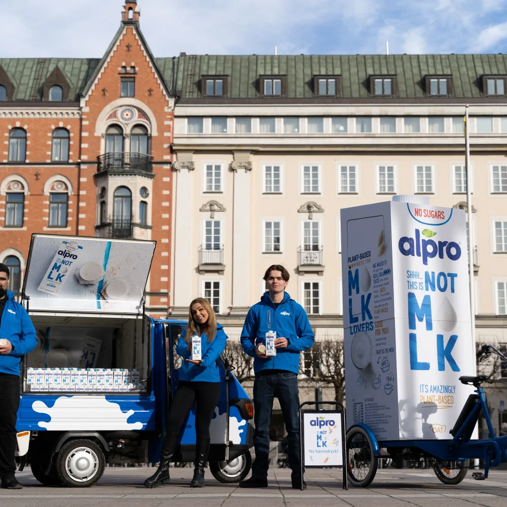Our event staff standing in front of an Alpro-branded event vehicle
