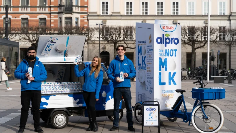 Our event staff standing in front of an Alpro-branded event vehicle